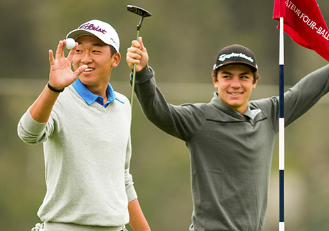 two young golfers smiling